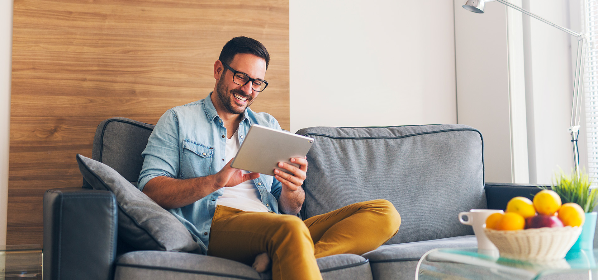 Slide Man on Couch with Tablet